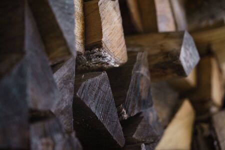 natural firewood stack rustic background closeup, chopped wood