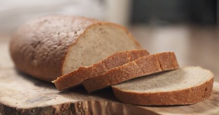 slices of rye wheat rustic bread on cutting board