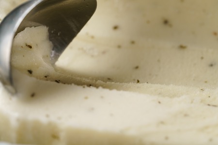 closeup of scooping lemon mint sorbet, shallow focus