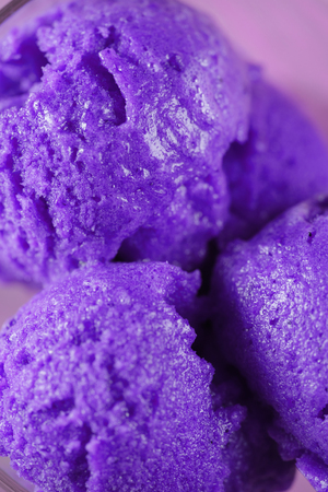scooped balls of purple ice cream close up shallow focusの写真素材