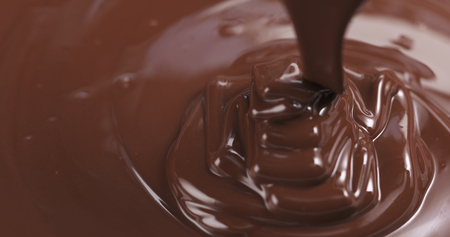 pouring melted premium dark chocolateの写真素材