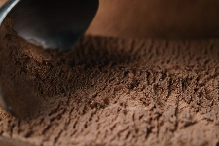closeup scooping chocolate ice creamの写真素材