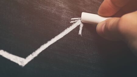 female teen hand drawing a graphの写真素材