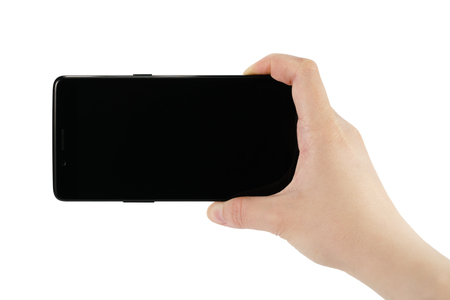 young female hand holding smartphone with black screen isolated on whiteの写真素材