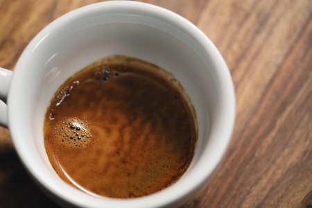 fresh espresso in cappuccino cup on table, shallow focusの写真素材