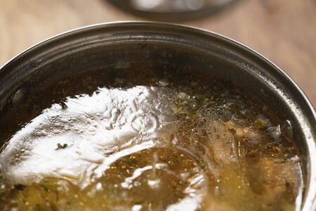 prepared hot trout soup with potatoes in pot