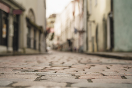 low angle closeup background of old pavement with blurred backgroundの写真素材