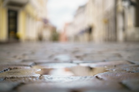Low angle closeup background of old pavement with blurred backgroundの写真素材