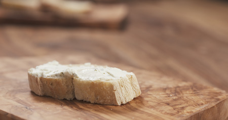 baguette slice with cream cheese, wide photo