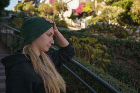 Portrait of teen girl on Lombard street in autumn day