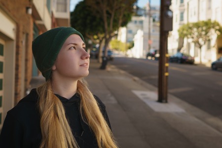 Portrait of teen girl on Lombard street in autumn dayの写真素材