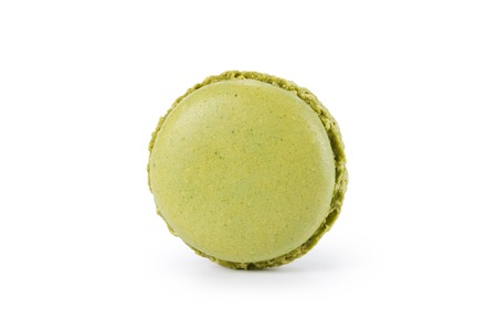 green macaron with jam isolated on whiteの写真素材