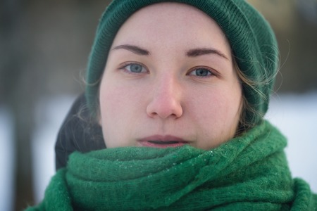 Teen girl breath out steam in cold winter dayの写真素材