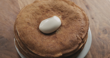 sour cream on top of pancakes or blini