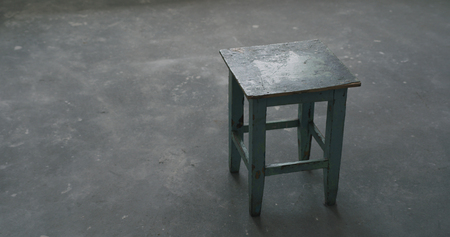 old stool in empty room during renovation