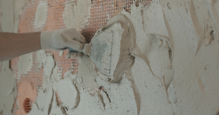 worker applying plaster on the wallの写真素材