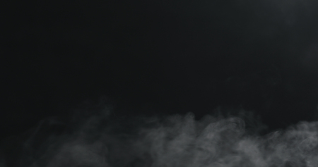 vapor steam rising over black backgroundの写真素材