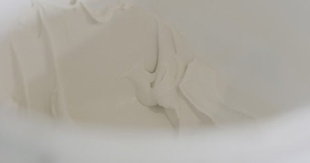 white putty ready to apply in a bucketの写真素材