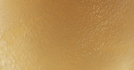 closeup of lager beer pouring in a glassの写真素材