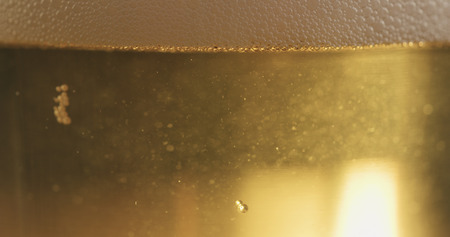 closeup of lager beer poured in a glass