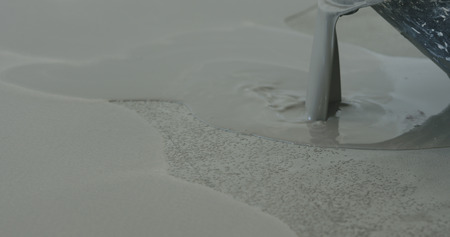 applying self leveling floorの写真素材