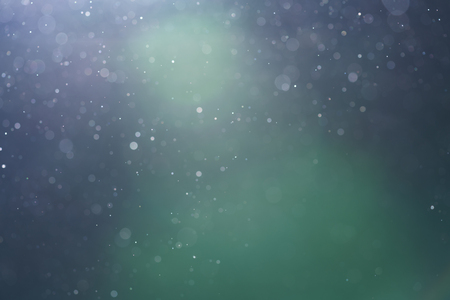 backlit real dust particles with lens flareの写真素材