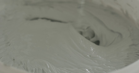 closeup mixing gray decorative concrete plasterの写真素材