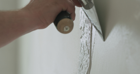 closeup worker applying decorative concrete plaster on the wallの写真素材
