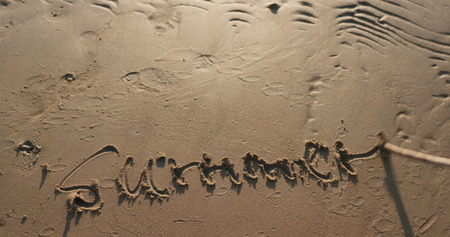 writing word summer on sand beachの写真素材