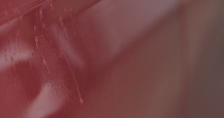 Closeup focus red car wash degreasing paint soakの写真素材