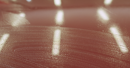Closeup red car wash shampoo soak, wide photoの写真素材