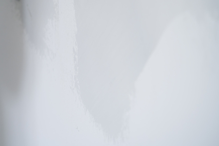 closeup applying decorative concrete plaster on the wallの写真素材