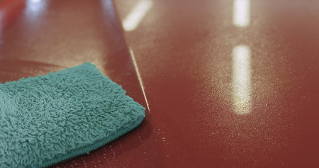 closeup of car paint deep cleaning with mitten, wide photoの写真素材