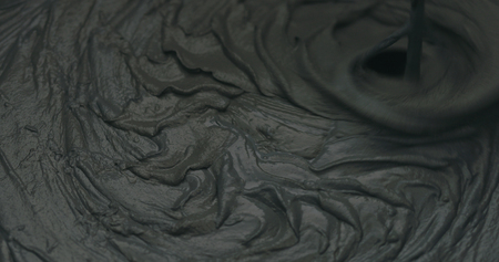 closeup mixing dark gray micro concrete plaster, wide photoの写真素材
