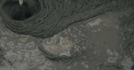 mixing water in micro concrete plaster, wide photo