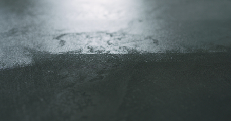 closeup applying protective coating on the concrete floorの写真素材