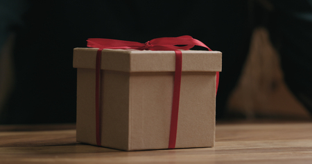 Closeup red ribbon bow on craft gift boxの写真素材