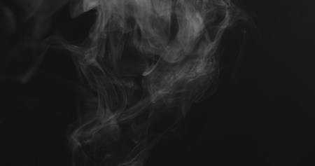 closeup vapor floating in air on black background, wide photo
