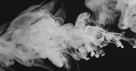 closeup vapor stream from right on black background, wide photoの写真素材