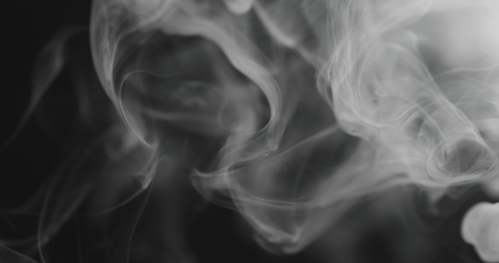 closeup vapor floating in air on black background, wide photoの写真素材