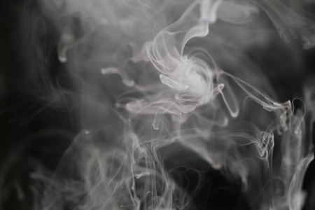 closeup abstract vapor over black background for backdrop or overlay, shallow focusの写真素材