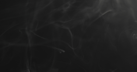 closeup vapor floating in air on black backgroundの写真素材