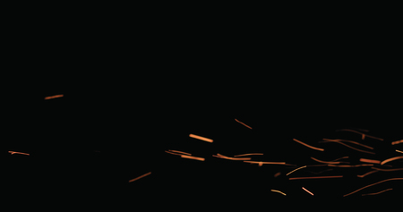 hot sparks floating from side on black background, wide photoの写真素材