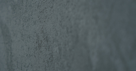 decorative dark concrete background with shallow focus