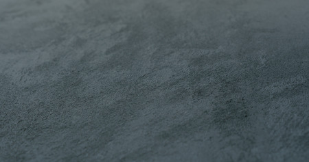 decorative dark concrete background with shallow focus, good for backgroundの写真素材