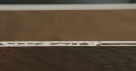 pour wood glue on oak board