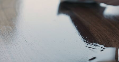 freshly applied oil finish to black walnut boardの写真素材
