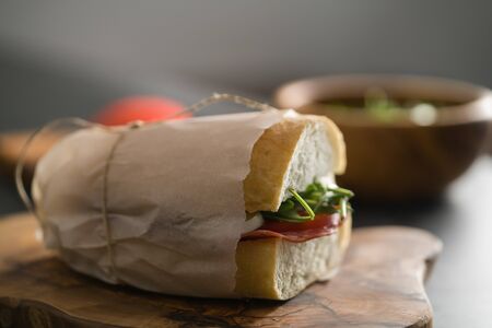 ciabatta sandwich with salami and mozzarella cheese on terrazzo countertopの写真素材