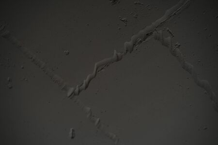 angle shot of white concrete wall in the dark