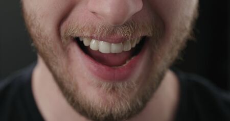 closeup shot of bearded man mouth laughing, wide photo